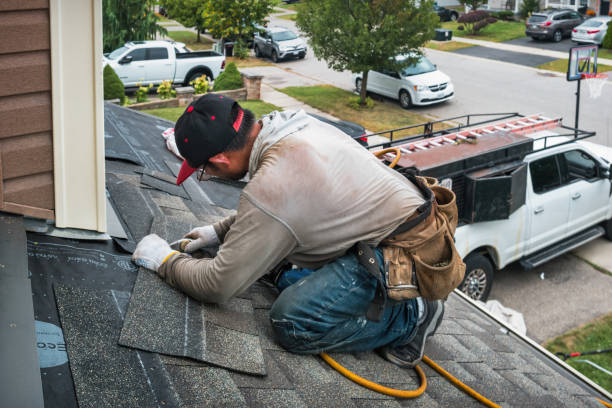 Professional Flat Roof Repair technician working in Williamsburg, MI